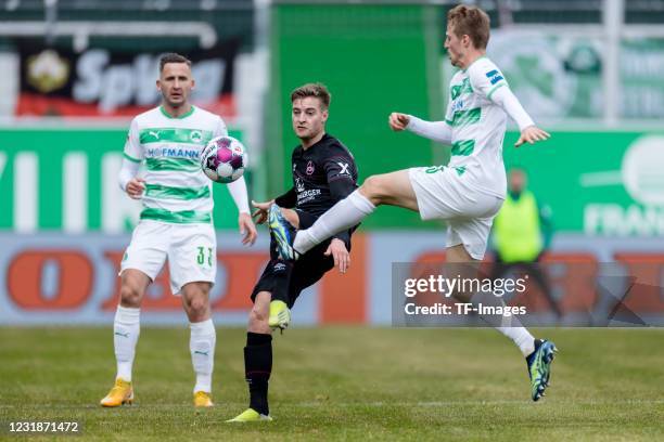 Fabian Nuernberger of 1. FC Nuernberg and Sebastian Ernst of SpVgg Greuther Fuerth battle for the ball during the Second Bundesliga match between...