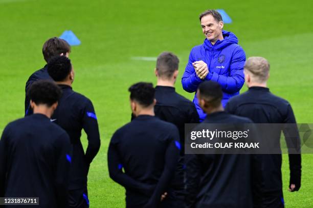 Coach Frank de Boer of the Dutch national team addresses his players during a training session in Zeist, on March 22 in preparation for the World Cup...