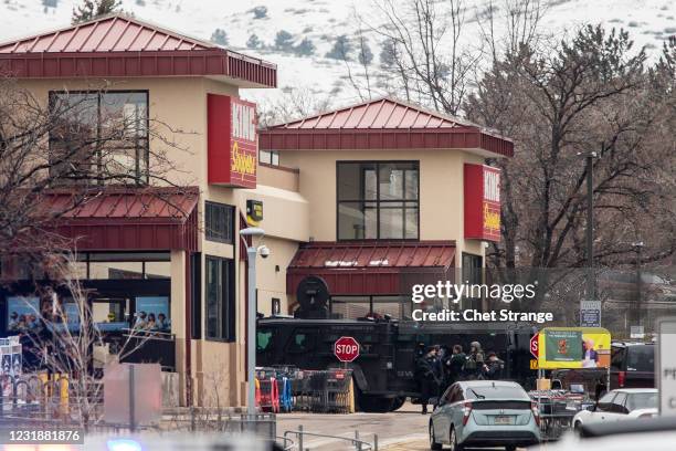 Police used armored vehicles to smash windows and walls to gain access as a gunman opened fire at a King Sooper's grocery store on March 22, 2021 in...