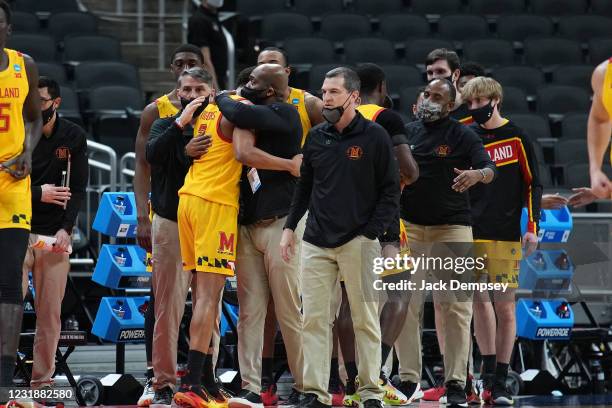 Aaron Wiggins of the Maryland Terrapins is consoled by teammates and coaches in the final minute of the teams loss to the Alabama Crimson Tide in the...