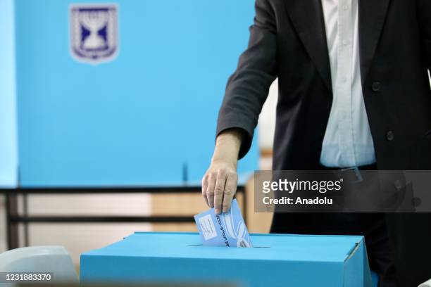 People arrive at a polling station to cast vote during 2021 Israeli legislative election in Bnei Brak, Israel on March 23, 2021.