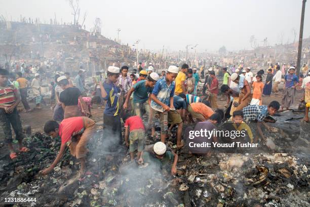 Rohingya refugees search for their belongings after a fire broke out at Balukhali rohingya refugees camp, Cox's Bazar. A huge fire swept through a...