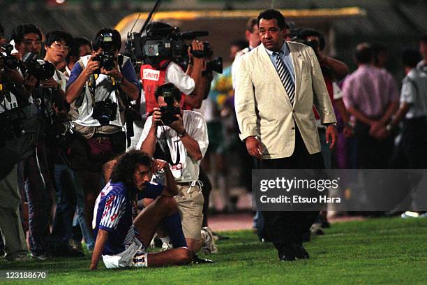 Japan head coach Hans Ooft consoles Ramos Ruy after the 1994 FIFA World Cup Asian Final Qualifier match between Japan and Iraq at Al-Ahly Stadium on...