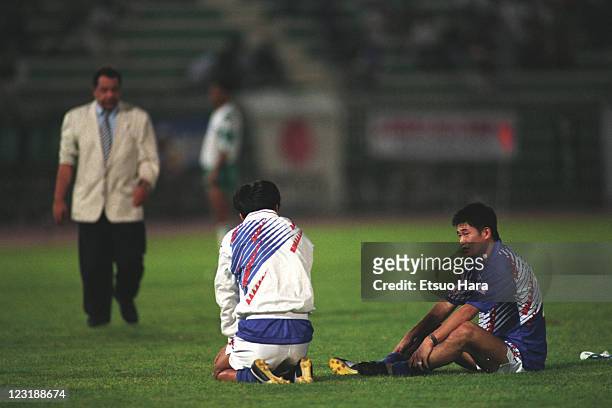 Kazuyoshi Miura of Japan is consoled by Yasutoshi Miura after the 1994 FIFA World Cup Asian Final Qualifier match between Japan and Iraq at Al-Ahly...