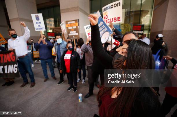 Yesenia Barrera, right, a former Amazon employee in San Bernardino County spoke to the crowd gathered outside the building at 1 Cal Plaza at 300...