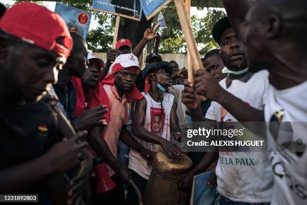 Supporters of re-elected President Denis Sassou Nguesso gather outside the headquarters of his Congolese Labor Party in Brazzaville on March 23,...