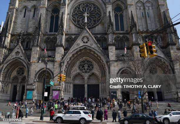 People join on the steps of the Cathedral of St. John the Divine in New York for a Service of Prayer and Witness Against Anti-Asian Violence on March...