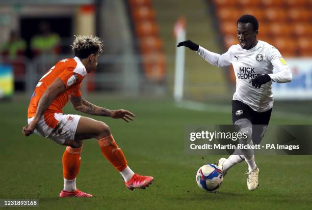 Blackburn Rovers' Ryan Nyambe and Peterborough United's Siriki Dembele battle for the ball during the Sky Bet League One match at Bloomfield Road...