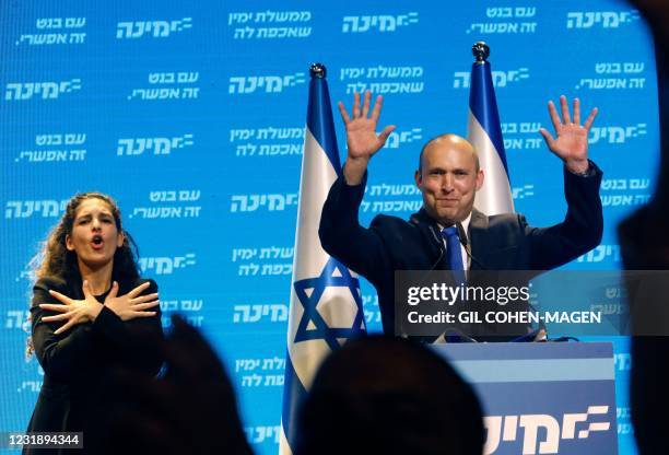 Naftali Bennett, leader of the Israeli right-wing Yamina party, addresses supporters at his party's campaign headquarters in the Mediterranean...