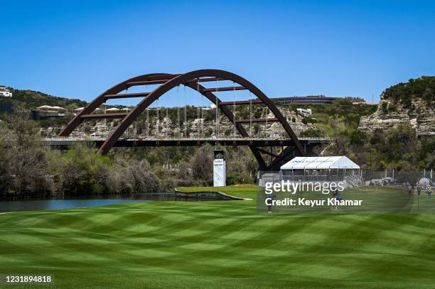 Course scenic view as Tommy Fleetwood of England plays his third shot on the 12th hole facing the Pennybacker Bridge prior to the World Golf...