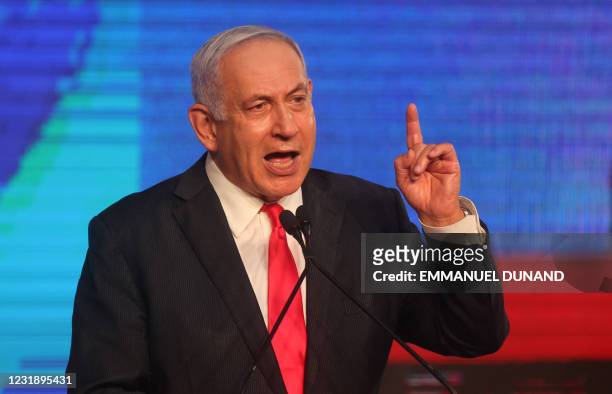 Israeli Prime Minister Benjamin Netanyahu, leader of the Likud party, addresses supporters at the party campaign headquarters in Jerusalem early on...
