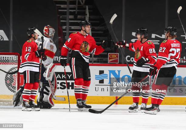 Carl Soderberg of the Chicago Blackhawks celebrates with teammates after scoring a goal against the Florida Panthers in the second period at the...