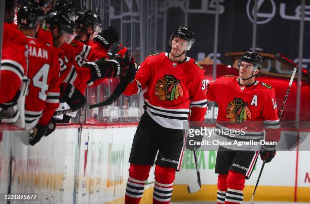 Carl Soderberg of the Chicago Blackhawks celebrates with teammates on the bench after scoring a goal against the Florida Panthers in the second...