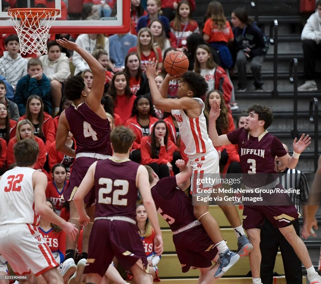 Wilson's Stevie Mitchell goes up to the basket against Gov. Mifflin's