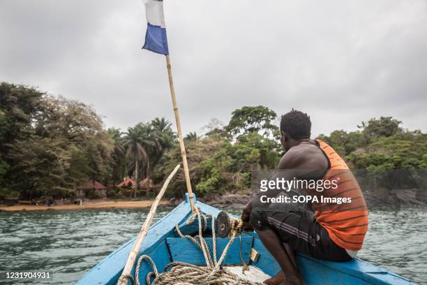 Boat approaches Dublin in Sierra Leone's Banana Islands. The Banana Islands were once a slave trading port. They are now home to a few hundred...