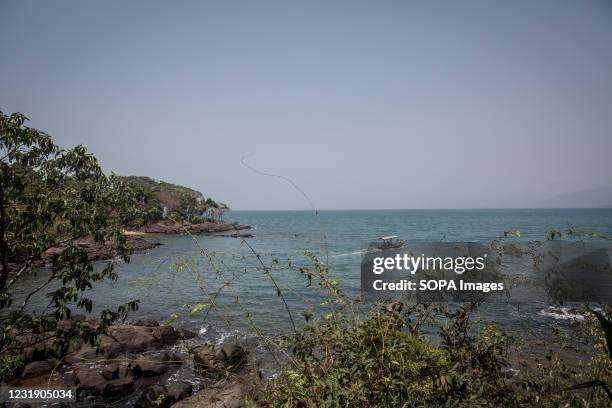 Boat sails out of port from Sierra Leone's Banana Islands. The Banana Islands were once a slave trading port. They are now home to a few hundred...