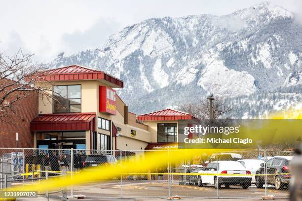 Crime tape surrounds a King Soopers grocery store on March 24, 2021 in Boulder, Colorado. Ten people, including a police officer, were killed in the...