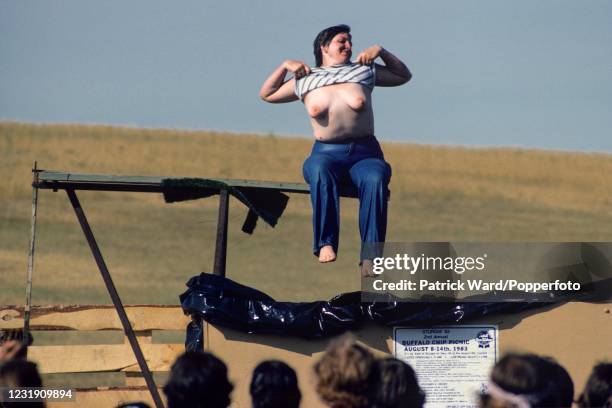 Biker baring her breasts during the 43rd annual Black Hills Classic Motorcycle Rally, possibly the largest in the United States, held in the small...