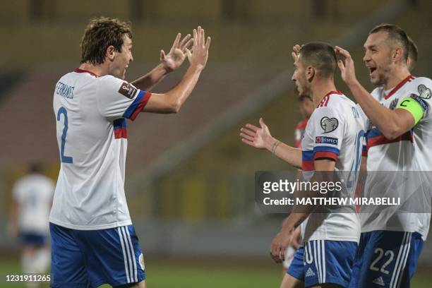 Russia's defender Mario Fernandes celebrates after scoring Russia's second goal during the FIFA World Cup Qatar 2022 Group H qualification football...