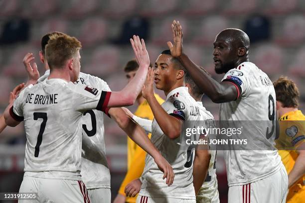 Belgium's forward Romelu Lukaku celebrates with teammates after scoring on a penalty kick during the FIFA World Cup Qatar 2022 qualification football...