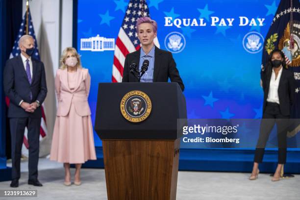 Megan Rapinoe, player with the U.S. Women's National Soccer Team, speaks as U.S. President Joe Biden and First Lady Jill Biden listen during an event...