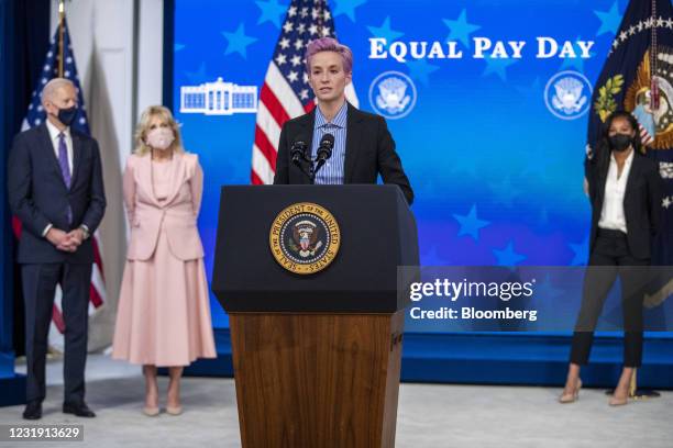 Megan Rapinoe, player with the U.S. Women's National Soccer Team, speaks as U.S. President Joe Biden and First Lady Jill Biden listen during an event...