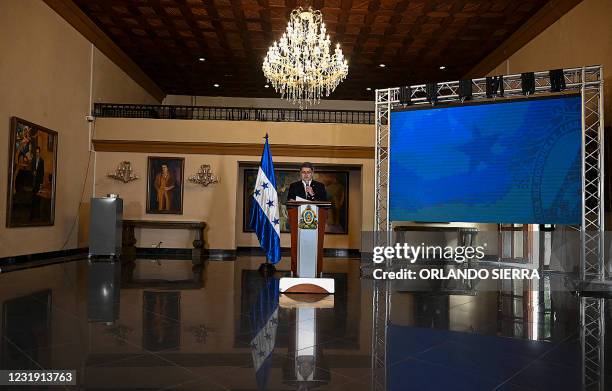 Honduras' President Juan Orlando Hernandez delivers a press conference at the presidential house in Tegucigalpa, on March 24, 2021. - President Juan...