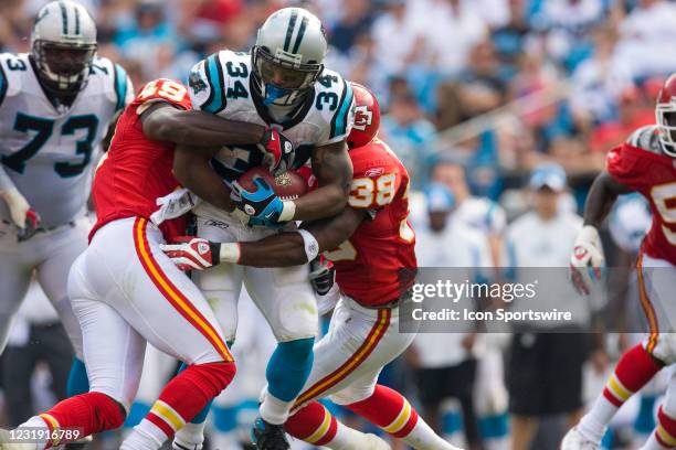 Carolina Panthers running back DeAngelo Williams is tackled by Kansas City Chiefs SS Bernard Pollard and safety DaJuan Morgan during an NFL football...