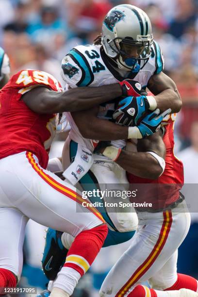 Carolina Panthers running back DeAngelo Williams is tackled by Kansas City Chiefs SS Bernard Pollard and safety DaJuan Morgan during an NFL football...