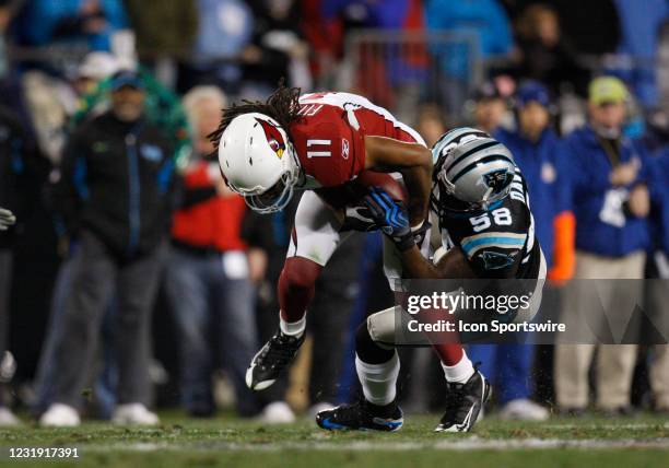 Carolina Panthers linebacker Thomas Davis tackles Arizona Cardinals wide receiver Larry Fitzgerald in their NFC Divisional Round NFL playoff football...