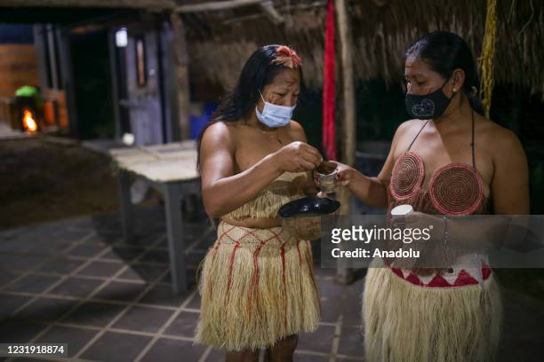 Tukano Oriental Indigenous women are seen at the maloca at the Panure indigenous reservation in San Jose del Guaviare, Colombia on March 24, 2021....