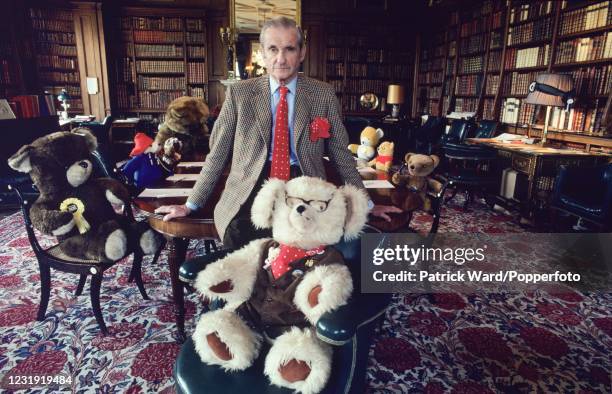 Henry Thynne, the 6th Marquess of Bath, in his library with some of his Teddy Bears at Longleat House, circa May 1982.