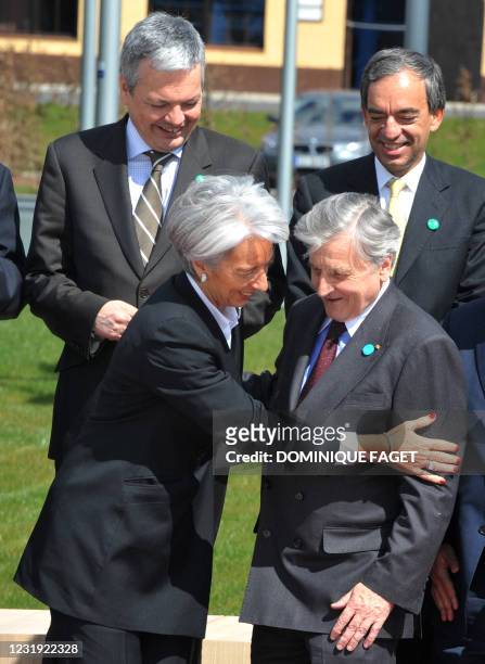 Belgian Finance Minister Didier Reynders with Cyprus counterpart Charilaos Stavrakis view French Economy Minister Christine Lagarde talking to the...