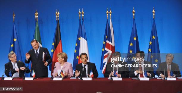 French President Nicolas Sarkozy , flanked by Luxemburg's Prime Minister Jean-Claude Juncker, Italian Prime Minister Silvio Berlusconi, German...
