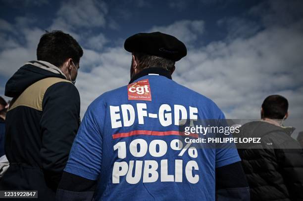 French union members take part in a protest against the planned 'Hercules' restructuring deal proposed for state-controlled energy group EDF outside...
