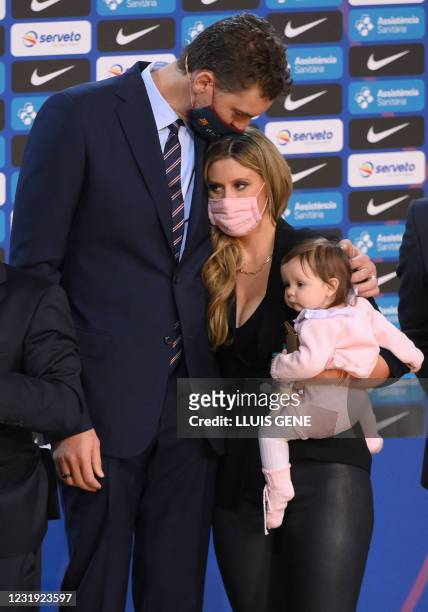 Spanish pivot Pau Gasol kisses his wife Catherine McDonnell who holds their daughter Elisabet Gianna during his official presentation as new player...