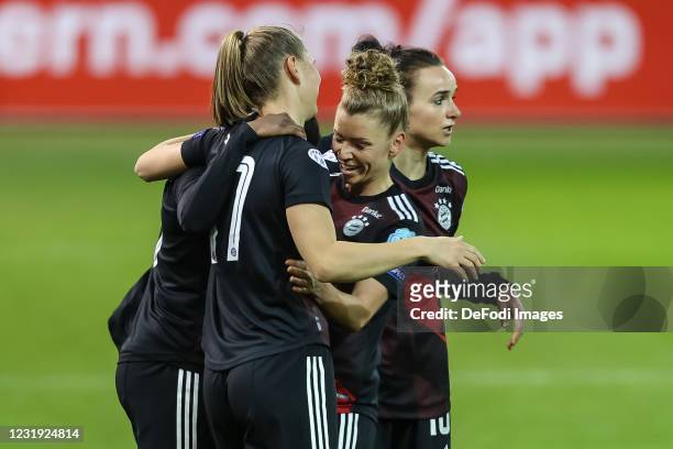 Marina Hegering of FC Bayern Munich celebrates after scoring her team's second goal with teammates during the First Leg of the UEFA Women's Champions...
