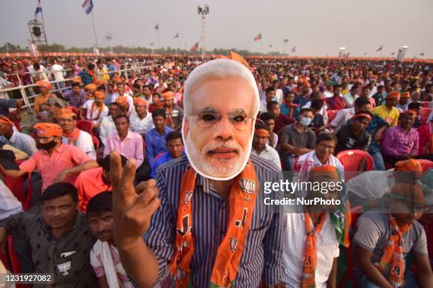 Bharatiya Janata Party supporters attend Indian Prime Minister Narendra Modis , election rally in Sipajhar, Darrang district of Assam, India, 24...