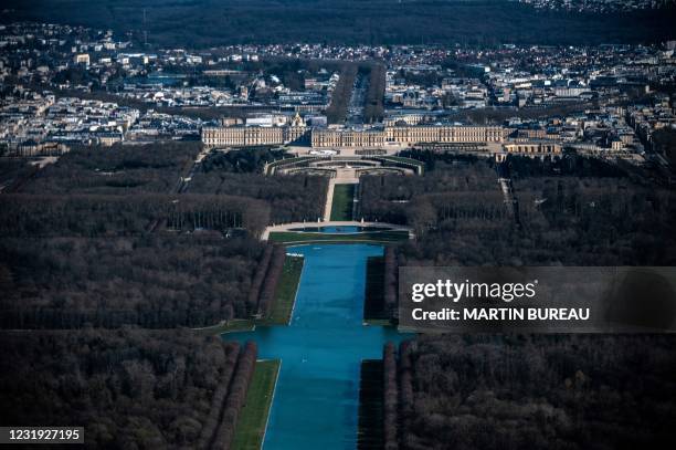 An aerial picture taken on March 24 shows a view of Versailles' castle, its gardens and the Grand Canal in Versailles, West of Paris.