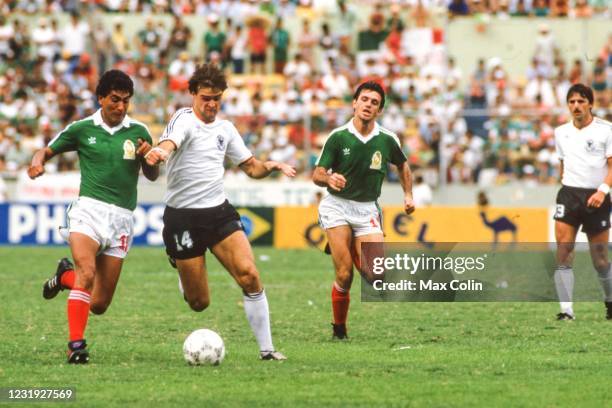 Javier Aguirre of Mexico and Thomas Berthold of West Germany during the FIFA World Cup Quarter Final match between West Germany and Mexico, at...