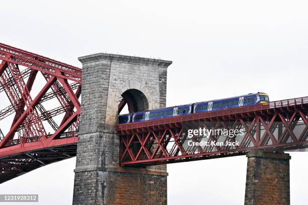 ScotRail train on the Forth Bridge as the RMT union announces a series of one-day strikes in a dispute over overtime pay, on March 25, 2021 in...