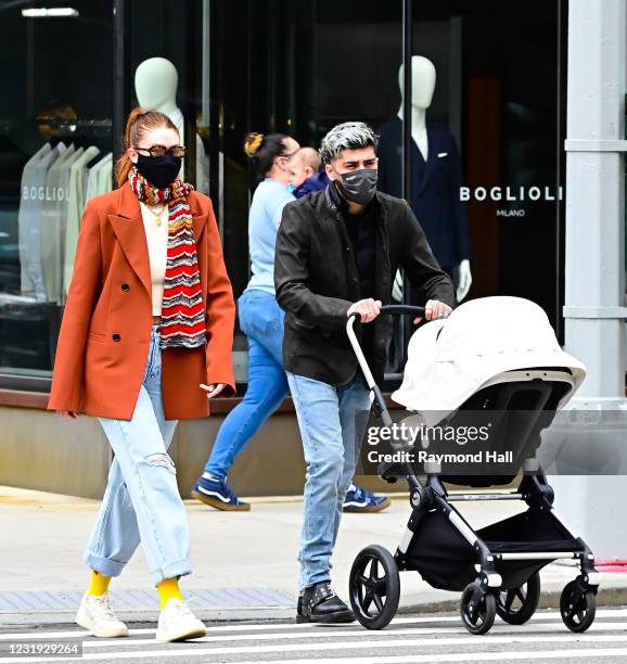 Gigi Hadid and Zayn Malik are seen walking in SoHo on March 25, 2021 in New York City.