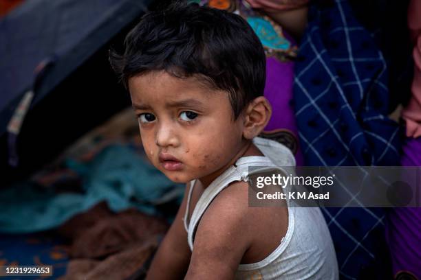 Portrait of a Rohingya refugee boy after a massive fire broke out 22 March 2021 destroyed thousands of shelters. Fifteen people died and 400...