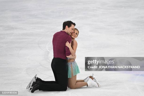 Canada's Kirsten Moore-Towers and Michael Marinaro perform during the pairs' free skating programme event at the ISU World Figure Skating...