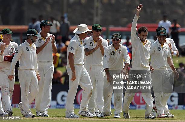 Australia cricketer Nathan Lyon shows the ball end of the Sri Lankan innings during the second day of the Test cricket match between Australia and...