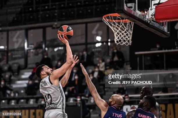Lyon-Villeurbanne's French centre Amine Noua scores during the Euroleague basketball match between ASVEL Villeurbanne and Real Madrid at the...