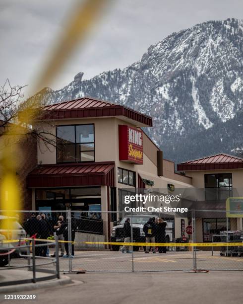 Police tape lines the site of a shooting at a King Soopers grocery store on March 25, 2021 in Boulder, Colorado. The Monday shooting left 10 people...