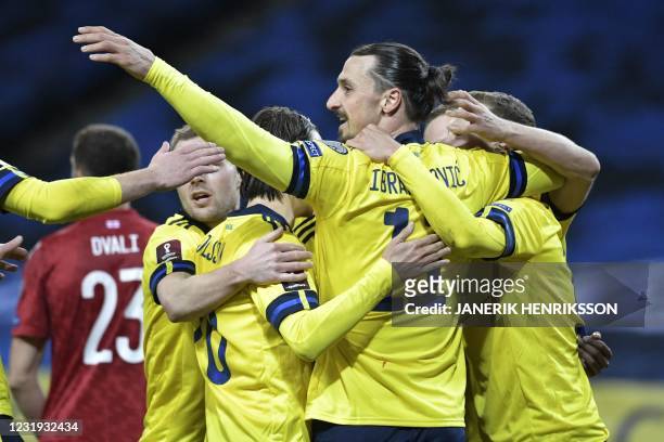 Sweden's forward Zlatan Ibrahimovic and his teammates celebrate the first goal during the FIFA World Cup Qatar 2022 qualification football match...
