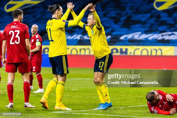 Viktor Claesson of Sweden embraces teammate Zlatan Ibrahimovic after scoring the 1-0 goal during the FIFA World Cup 2022 Qatar qualifying match...