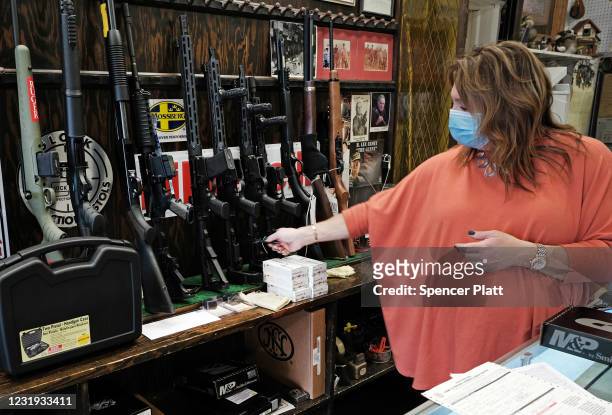 Lisa Caso sells guns at Caso's Gun-A-Rama store on March 25, 2021 in Jersey City, New Jersey. Caso's Gun-A-Rama has had a significant increase in...